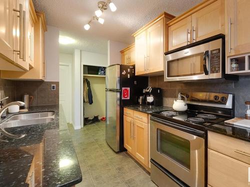 305 8215 83 Avenue, Edmonton, AB - Indoor Photo Showing Kitchen With Double Sink