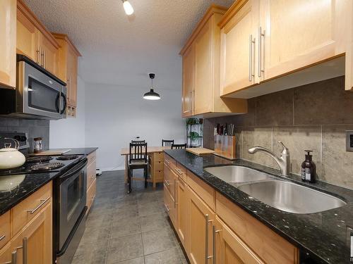 305 8215 83 Avenue, Edmonton, AB - Indoor Photo Showing Kitchen With Double Sink