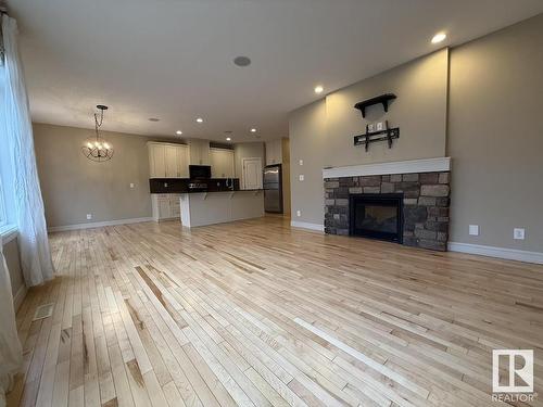 2309 Sparrow Crescent, Edmonton, AB - Indoor Photo Showing Living Room With Fireplace