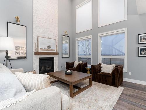 202 Woodhill Lane, Fort Saskatchewan, AB - Indoor Photo Showing Living Room With Fireplace