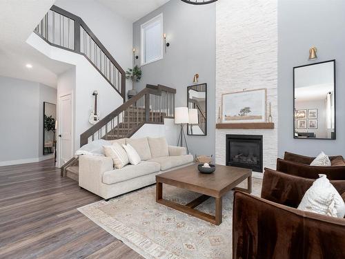 202 Woodhill Lane, Fort Saskatchewan, AB - Indoor Photo Showing Living Room With Fireplace