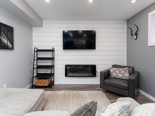 202 Woodhill Lane, Fort Saskatchewan, AB - Indoor Photo Showing Living Room With Fireplace