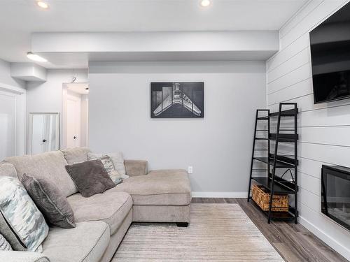 202 Woodhill Lane, Fort Saskatchewan, AB - Indoor Photo Showing Living Room With Fireplace