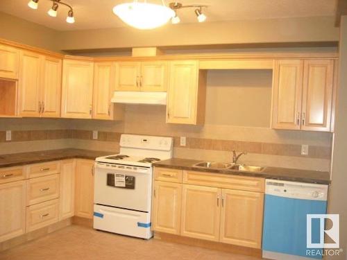 103 11827 105 Street, Edmonton, AB - Indoor Photo Showing Kitchen With Double Sink