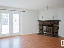 4802 52 Avenue, Bonnyville Town, AB  - Indoor Photo Showing Living Room With Fireplace 