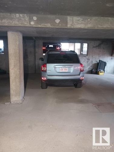 114 9010 106 Avenue, Edmonton, AB - Indoor Photo Showing Garage