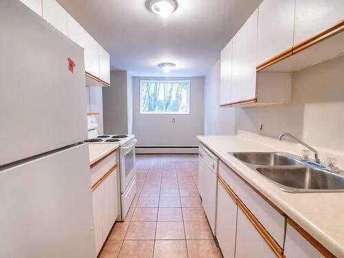 103 11831 106 Street, Edmonton, AB - Indoor Photo Showing Kitchen With Double Sink