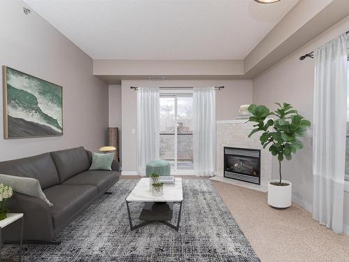 301 9750 94 Street, Edmonton, AB - Indoor Photo Showing Living Room With Fireplace