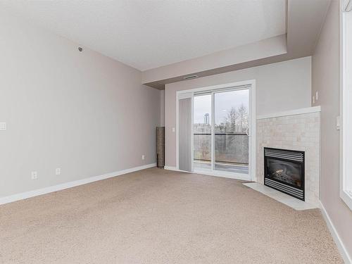 301 9750 94 Street, Edmonton, AB - Indoor With Fireplace