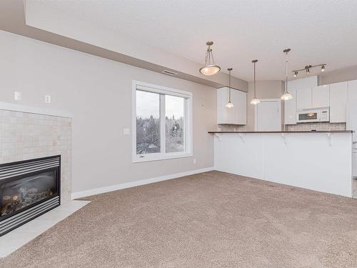 301 9750 94 Street, Edmonton, AB - Indoor With Fireplace