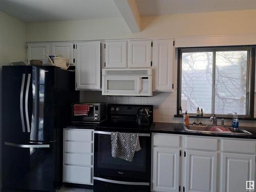 9624 75A Street, Edmonton, AB - Indoor Photo Showing Kitchen With Double Sink