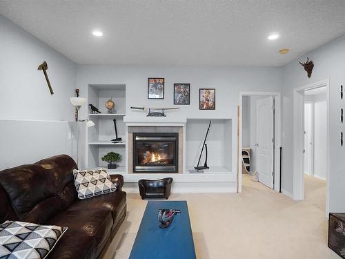 1445 Highwood Boulevard, Devon, AB - Indoor Photo Showing Living Room With Fireplace