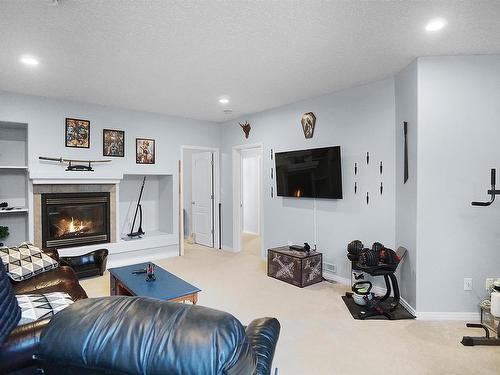 1445 Highwood Boulevard, Devon, AB - Indoor With Fireplace