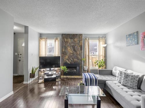 18415 66 Avenue, Edmonton, AB - Indoor Photo Showing Living Room With Fireplace