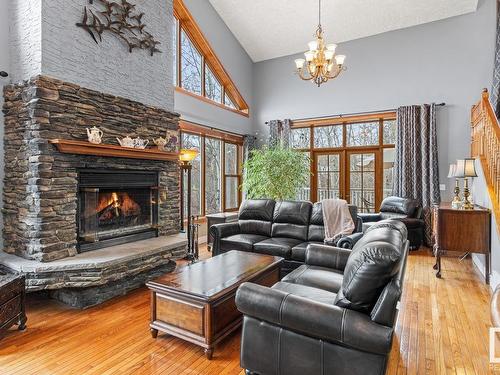 37 55312 Rge Road 241, Rural Sturgeon County, AB - Indoor Photo Showing Living Room With Fireplace