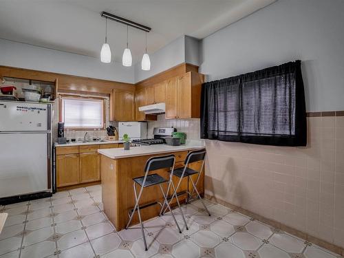 9531 109A Avenue, Edmonton, AB - Indoor Photo Showing Kitchen With Double Sink