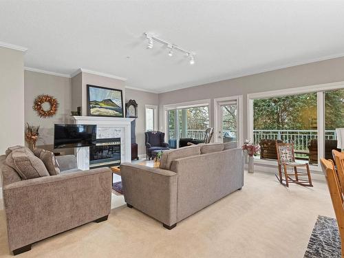 101 11640 79 Avenue, Edmonton, AB - Indoor Photo Showing Living Room With Fireplace