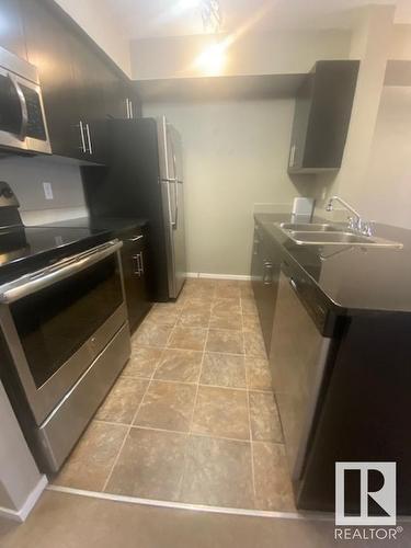 324 3315 James Mowatt Trail, Edmonton, AB - Indoor Photo Showing Kitchen With Double Sink