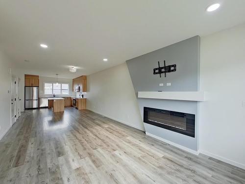 Main 5715 Hawthorn Common, Edmonton, AB - Indoor Photo Showing Living Room With Fireplace