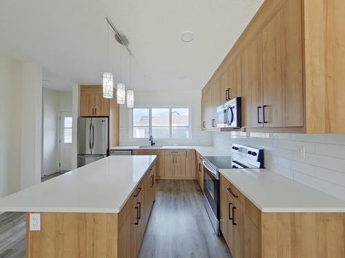 Main 5715 Hawthorn Common, Edmonton, AB - Indoor Photo Showing Kitchen With Stainless Steel Kitchen With Upgraded Kitchen