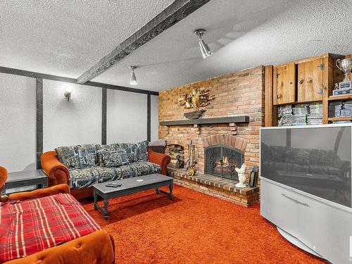 7308 149A Avenue, Edmonton, AB - Indoor Photo Showing Living Room With Fireplace