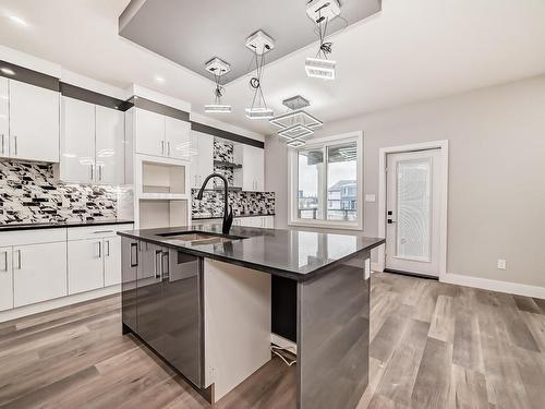 128 Edgewater Circle, Leduc, AB - Indoor Photo Showing Kitchen With Upgraded Kitchen