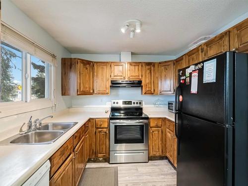 5957 40 Avenue, Edmonton, AB - Indoor Photo Showing Kitchen With Double Sink