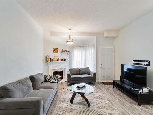 5957 40 Avenue, Edmonton, AB - Indoor Photo Showing Living Room With Fireplace