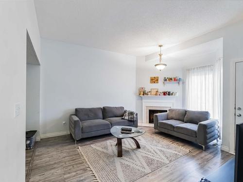 5957 40 Avenue, Edmonton, AB - Indoor Photo Showing Living Room With Fireplace