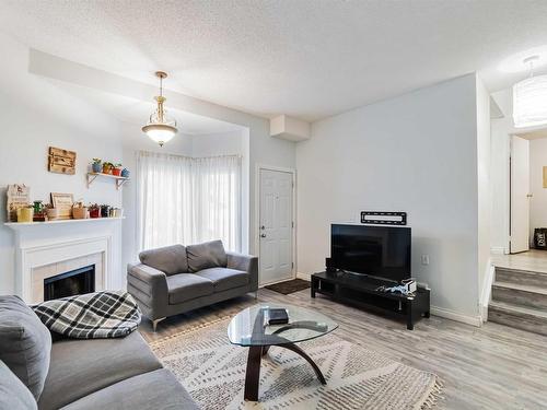 5957 40 Avenue, Edmonton, AB - Indoor Photo Showing Living Room With Fireplace