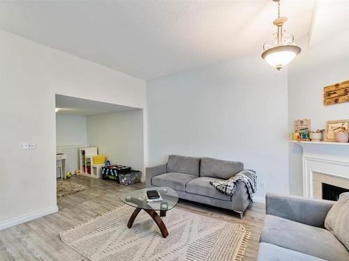 5957 40 Avenue, Edmonton, AB - Indoor Photo Showing Living Room With Fireplace