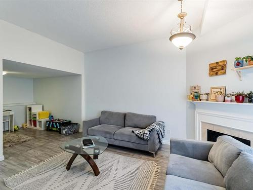 5957 40 Avenue, Edmonton, AB - Indoor Photo Showing Living Room With Fireplace