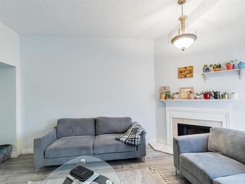 5957 40 Avenue, Edmonton, AB - Indoor Photo Showing Living Room With Fireplace