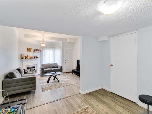 5957 40 Avenue, Edmonton, AB - Indoor Photo Showing Living Room With Fireplace