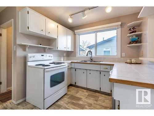 10948 37 Avenue Nw, Edmonton, AB - Indoor Photo Showing Kitchen With Double Sink