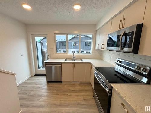 116 1025 Secord Promenade, Edmonton, AB - Indoor Photo Showing Kitchen With Double Sink