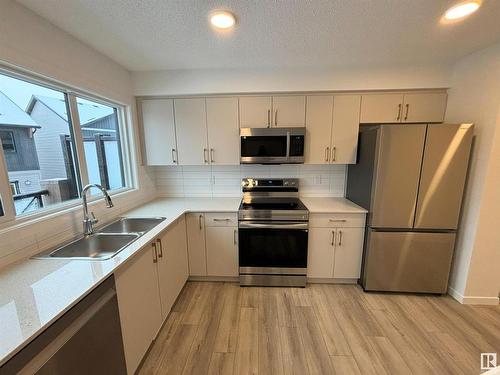 116 1025 Secord Promenade, Edmonton, AB - Indoor Photo Showing Kitchen With Double Sink