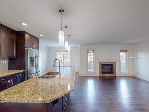 608 41 Ave, Edmonton, AB - Indoor Photo Showing Other Room With Fireplace