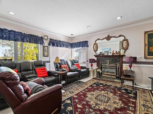 17 Osprey Point(E), St. Albert, AB - Indoor Photo Showing Living Room With Fireplace