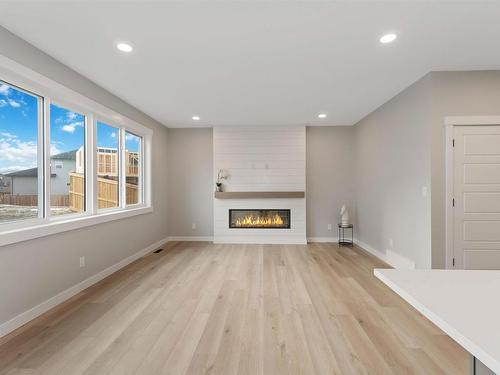 20 Hull Wynd, Spruce Grove, AB - Indoor Photo Showing Living Room With Fireplace