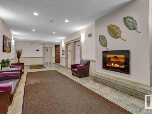 210 273 Charlotte Way, Sherwood Park, AB - Indoor With Fireplace