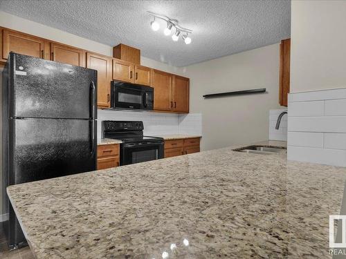 210 273 Charlotte Way, Sherwood Park, AB - Indoor Photo Showing Kitchen With Double Sink