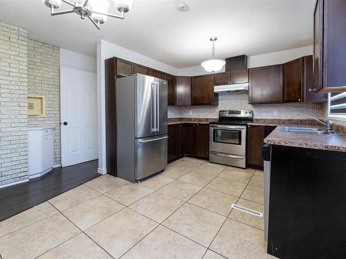 13411 61 Street, Edmonton, AB - Indoor Photo Showing Kitchen With Stainless Steel Kitchen With Double Sink