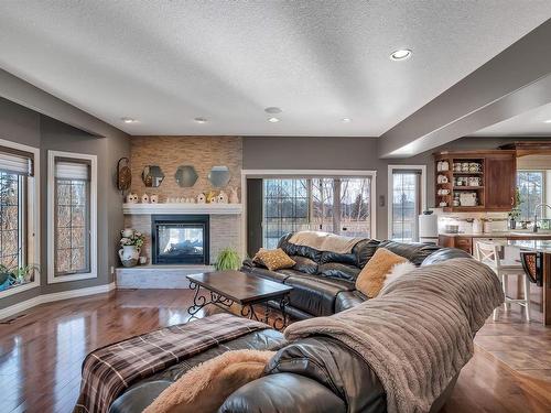 104 Linksview Drive, Spruce Grove, AB - Indoor Photo Showing Living Room With Fireplace