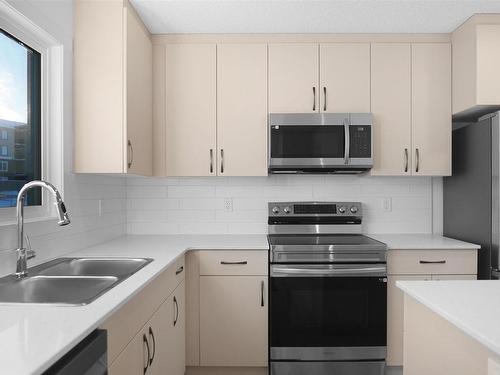 22 525 Secord Boulevard, Edmonton, AB - Indoor Photo Showing Kitchen With Double Sink