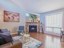 14167 26 Street, Edmonton, AB  - Indoor Photo Showing Living Room With Fireplace 