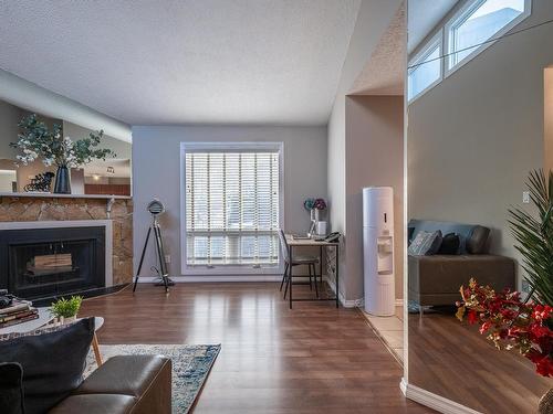 14167 26 Street, Edmonton, AB - Indoor Photo Showing Living Room With Fireplace