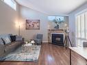 14167 26 Street, Edmonton, AB  - Indoor Photo Showing Living Room With Fireplace 