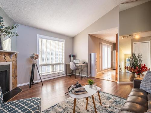 14167 26 Street, Edmonton, AB - Indoor Photo Showing Living Room With Fireplace