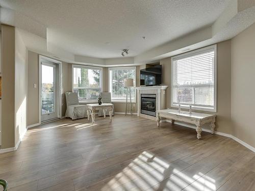 312 9008 99 Avenue, Edmonton, AB - Indoor Photo Showing Living Room With Fireplace